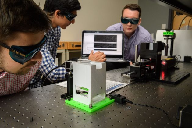 students researching laser