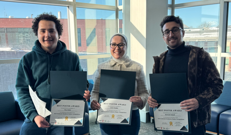 students holding awards