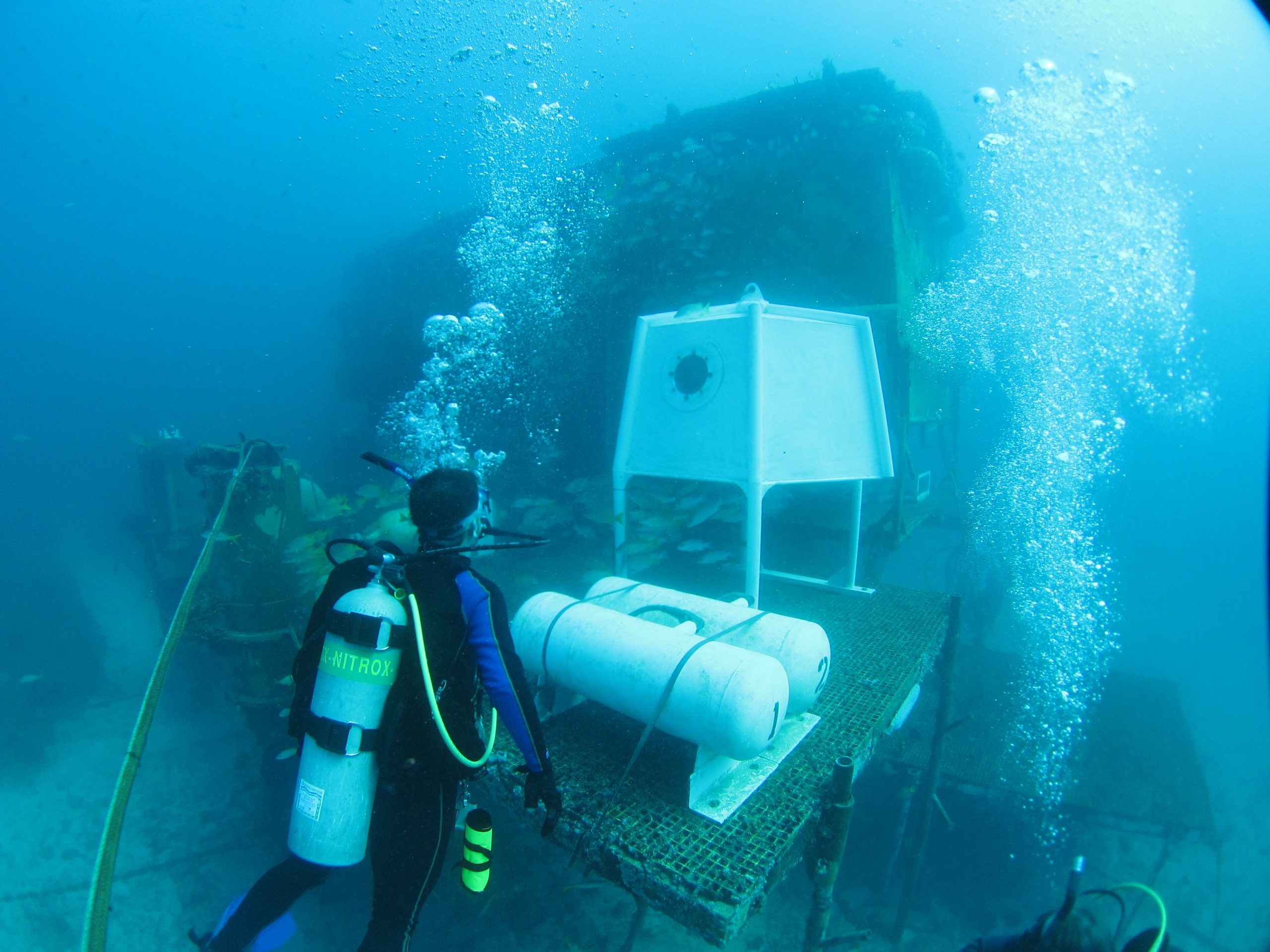 undersea laboratory with divers conducting research