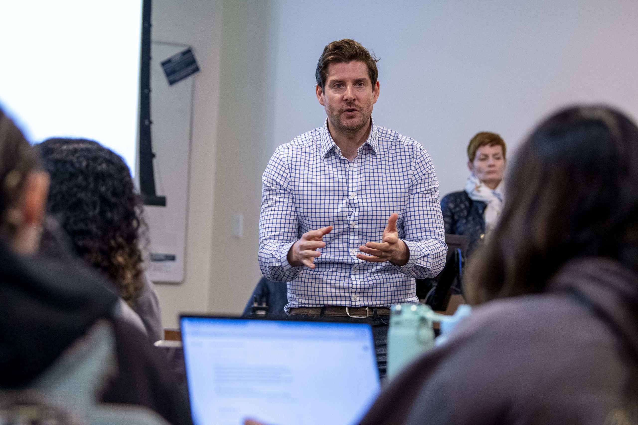 Students listening to Assistant Professor