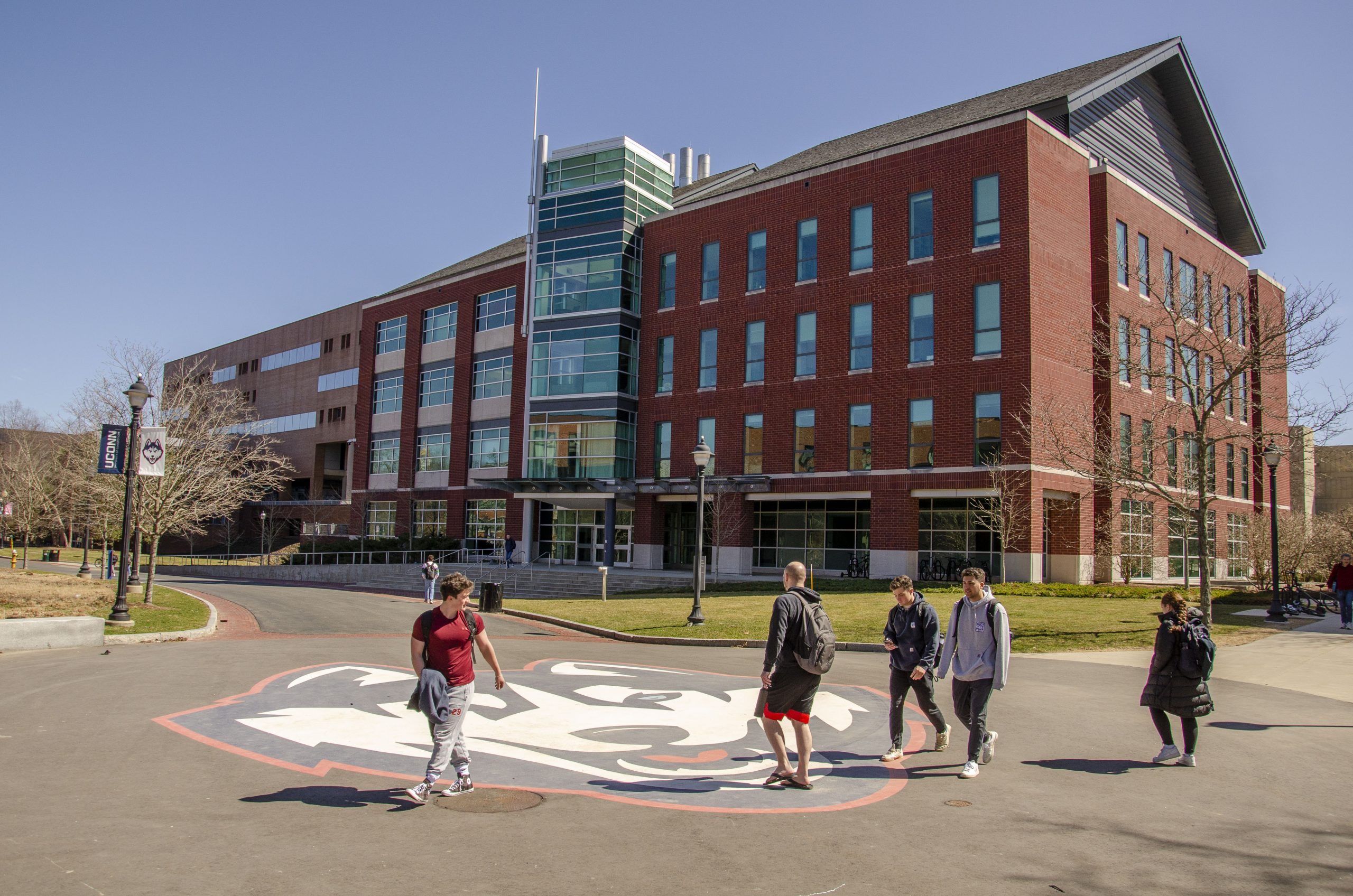 Information technology engineering building with students walking adjacent